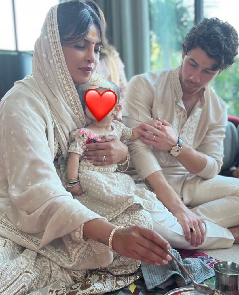 Jonas shared on his Instagram. His daughter Malti is sitting in her mother’s lap holding the finger of his father Jonas. In this picture, we could see they are offering some type of religious customs regarding Dewali.
